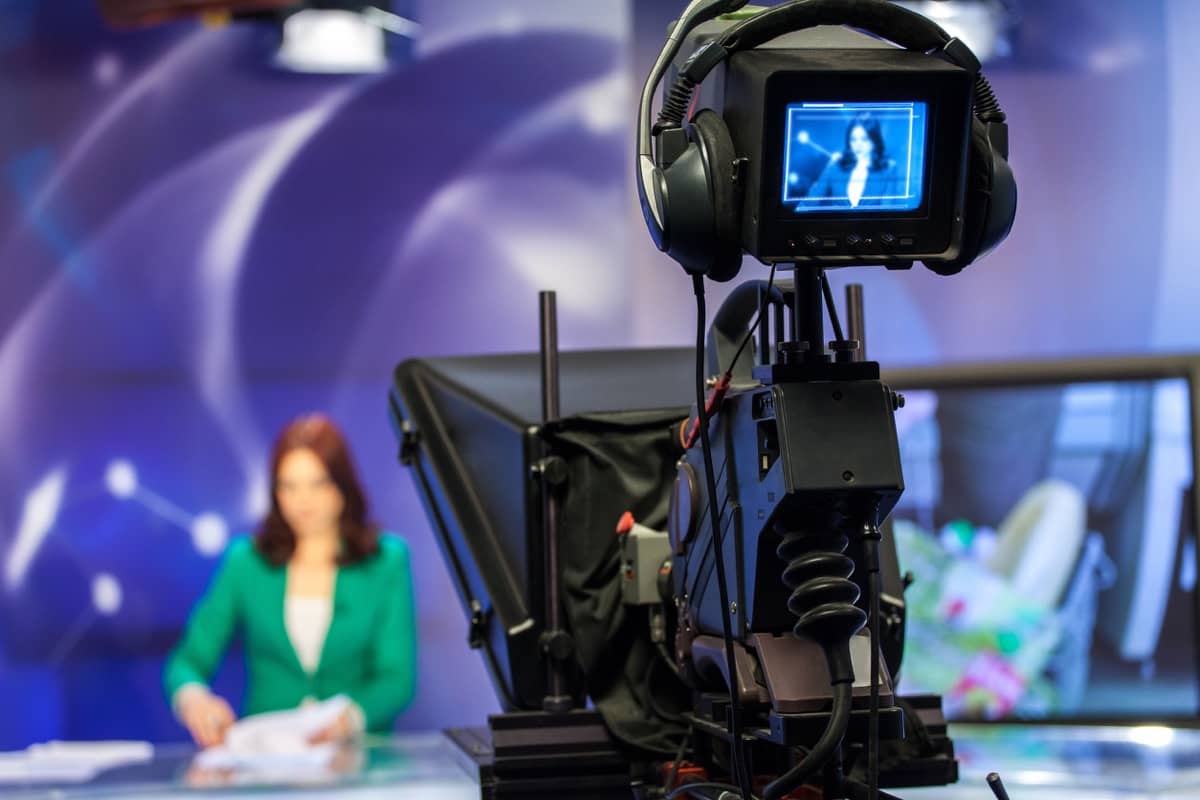 video camera viewfinder - recording show in tv studio - focus on camera; value of the Fourth Estate concept