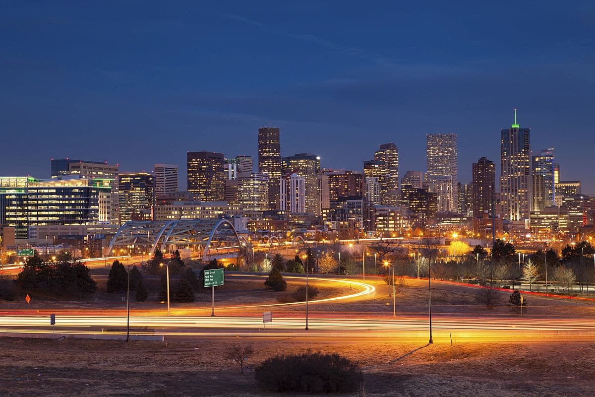 Denver Skyline. Image of Denver Skyline and busy highway in the foreground; denver software companies concept