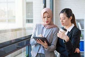 Muslim businesswoman sharing information.